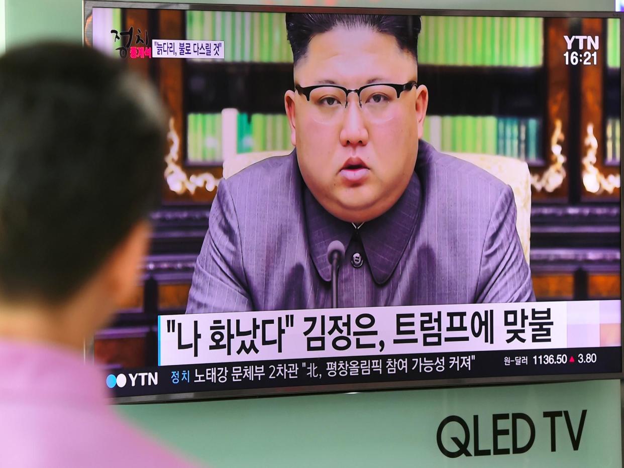 A man watches a television news screen showing a picture of North Korean leader Kim Jong-Un delivering a statement in Pyongyang, at a railway station in Seoul on 22 September 2017: JUNG YEON-JE/AFP/Getty Images