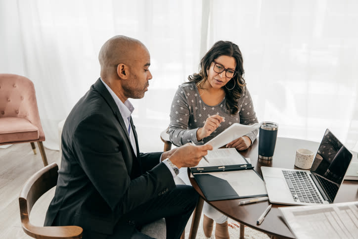 Financial advisors reviewing a book of business to buy a financial advisor practice.