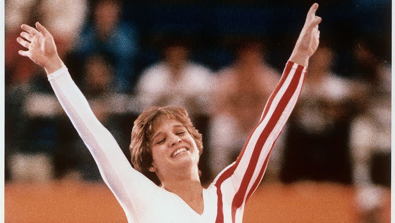 Mary Lou Retton celebrates her balance beam score at the 1984 Olympic Games in Los Angeles on Aug. 3, 1984. Retton, 16, became the first American woman ever to win an individual Olympic gold medal in gymnastics.