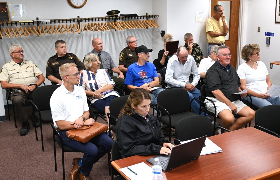 Township leaders and elected official fill the county commission courthouse meeting room for the discussion on funding and hiring six new road patrol deputies for 2024.