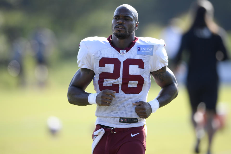 Washington running back Adrian Peterson (26) works out during practice at the team's NFL football training facility, Monday, Aug. 24, 2020, in Ashburn, Va. (AP Photo/Nick Wass)