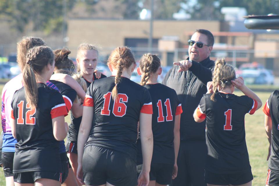 Cheboygan girls soccer coach Tom Markham gives a halftime talk to his team during Monday's matchup against Roscommon.