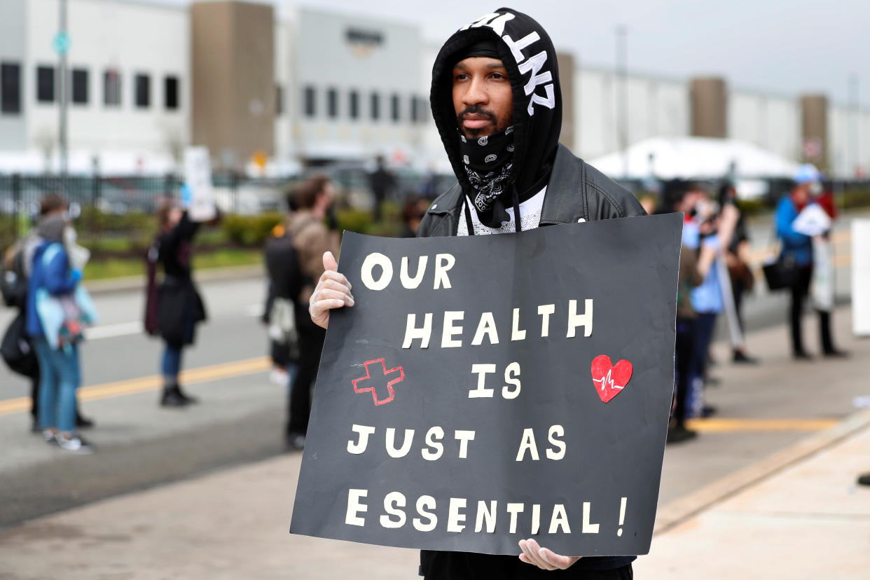 Former Amazon employee, Christian Smalls, stands with fellow demonstrators during a protest outside of an Amazon warehouse as the outbreak of the coronavirus disease (COVID-19) continues in the Staten Island borough of New York U.S., May 1, 2020. REUTERS/Lucas Jackson