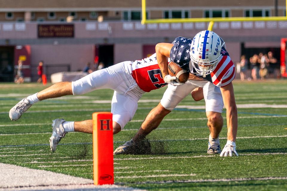 Team Rocky's Aaron Zalescik (South Hunterdon, 1) runs the ball against Team Otto in the inaugural Shaun O'Hara All-Star football game on June 12, 2024 night at the Hillsborough High School field.