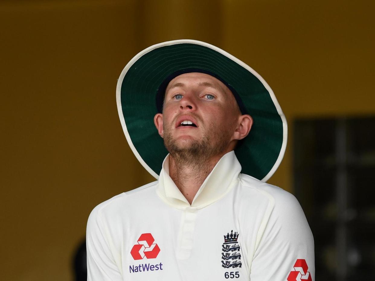 Root looks on during the warm-up match: Getty