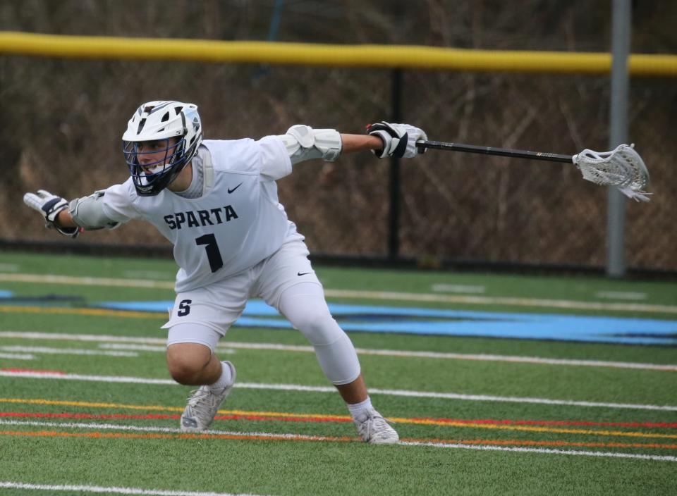 Ryan Rossi of Sparta celebrates after he scored a goal on this shot in the first half of the game as Sparta topped Mt. Olive 9-7 in a boys lacrosse game played at Sparta , NJ on April 6, 2022.