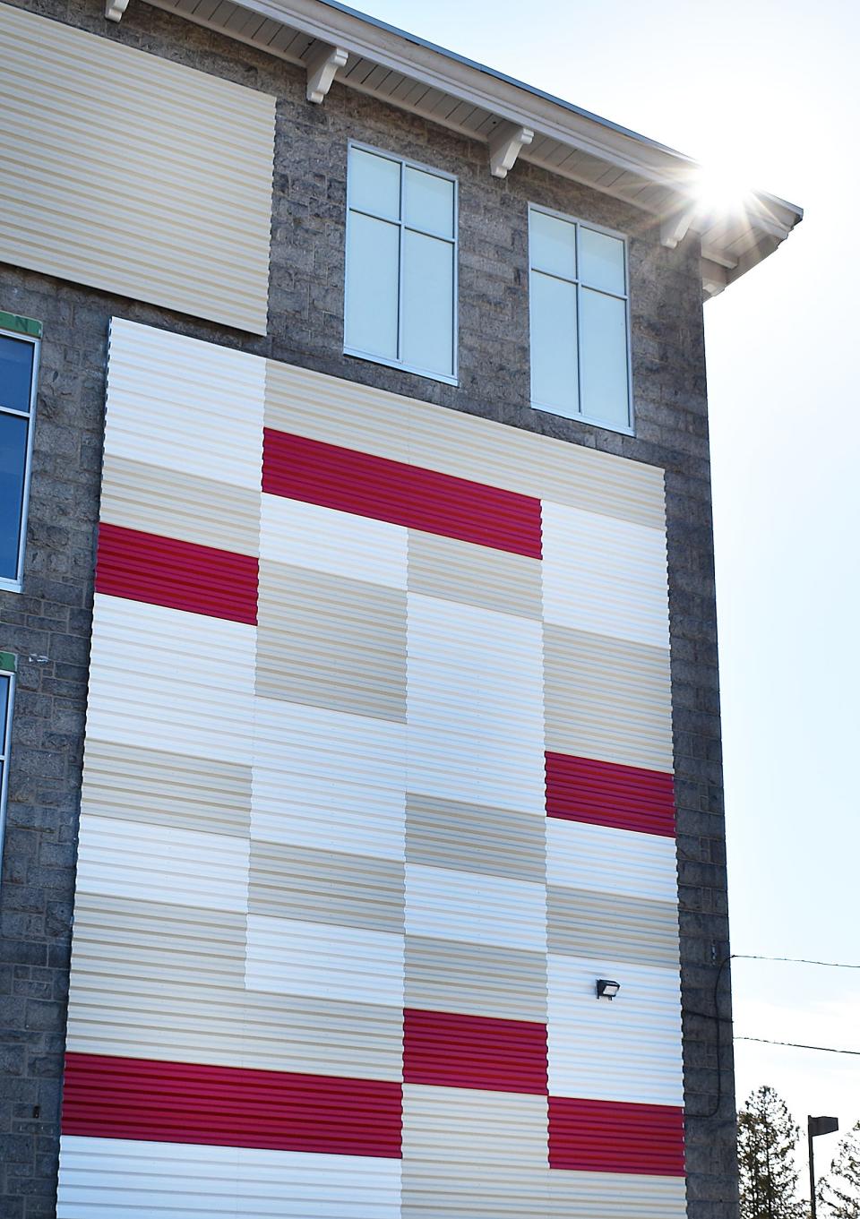 The mill at 288 Plymouth Ave., once home of the Richard Borden Manufacturing Co., is covered in multicolored corrugated metal panels.