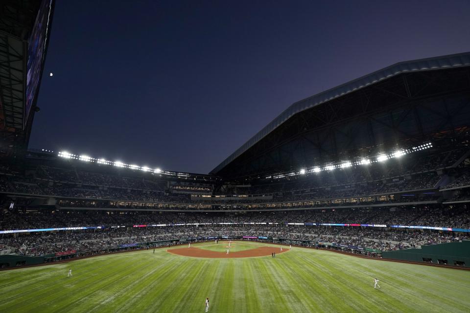 Texas Rangers starting pitcher Martin Perez takes warm up pitches as the team plays the New York Yankees in the fifth inning of a baseball game at Globe Life Field in Arlington, Texas, Monday, Oct. 3, 2022. (AP Photo/Tony Gutierrez)