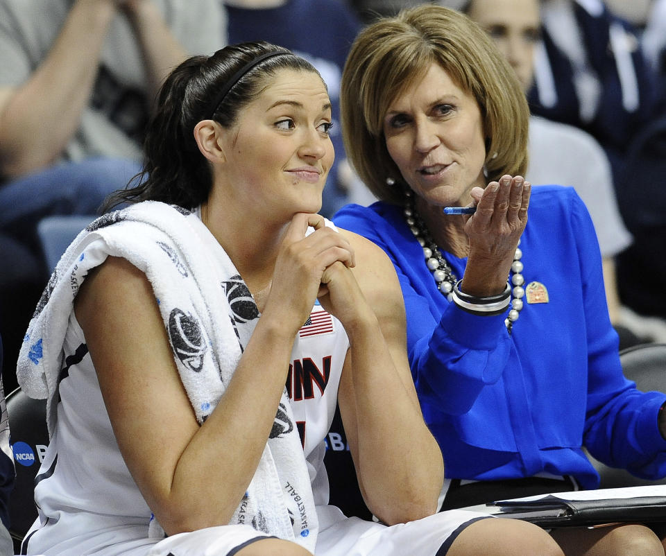 Connecticut's Stefanie Dolson, listens to associate head coach Chris Dailey, right, during the second half of a second-round game of the NCAA women's college basketball tournament, Tuesday, March 25, 2014, in Storrs, Conn. Connecticut won 91-52. (AP Photo/Jessica Hill)