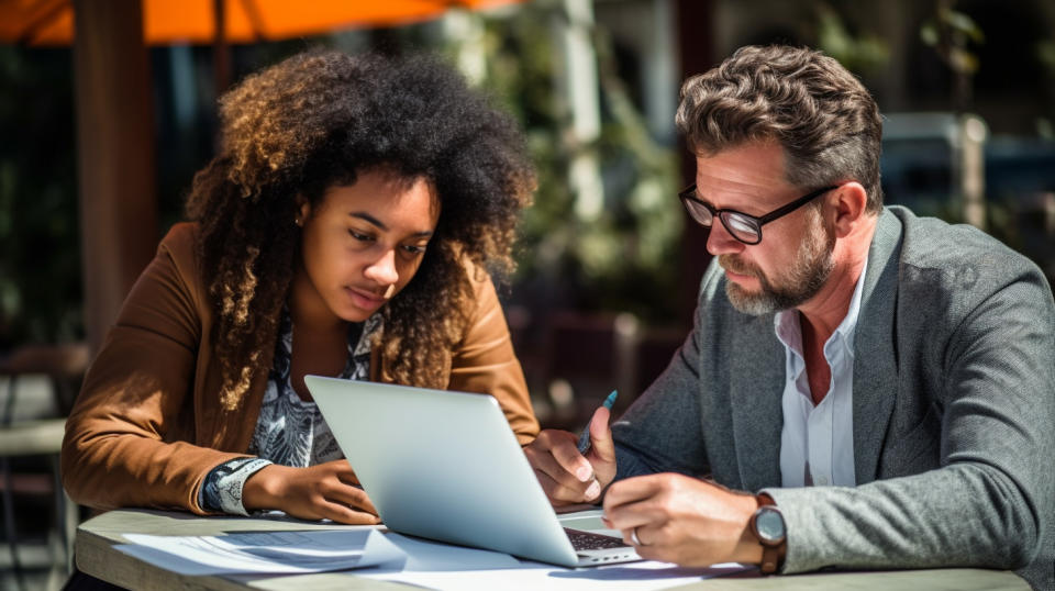 A college student applying for a loan, with a counselor offering them guidance.