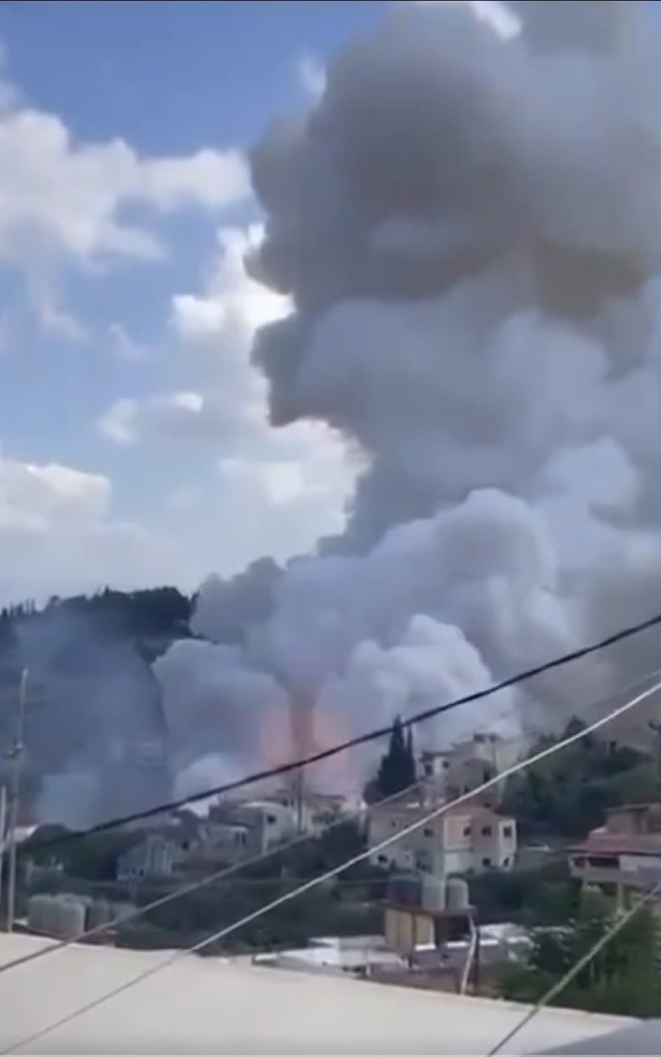 Plumes of smoke after an air strike in Beirut on Monday