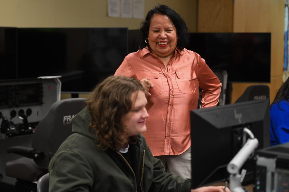 Sioux Falls team coach Valerie Vanhauvel talks with Jefferson student Alexander Loiselle-Carlson while playing League of Legends on Tuesday, March 19, 2024 at Career and Technical Education Academy in Sioux Falls.