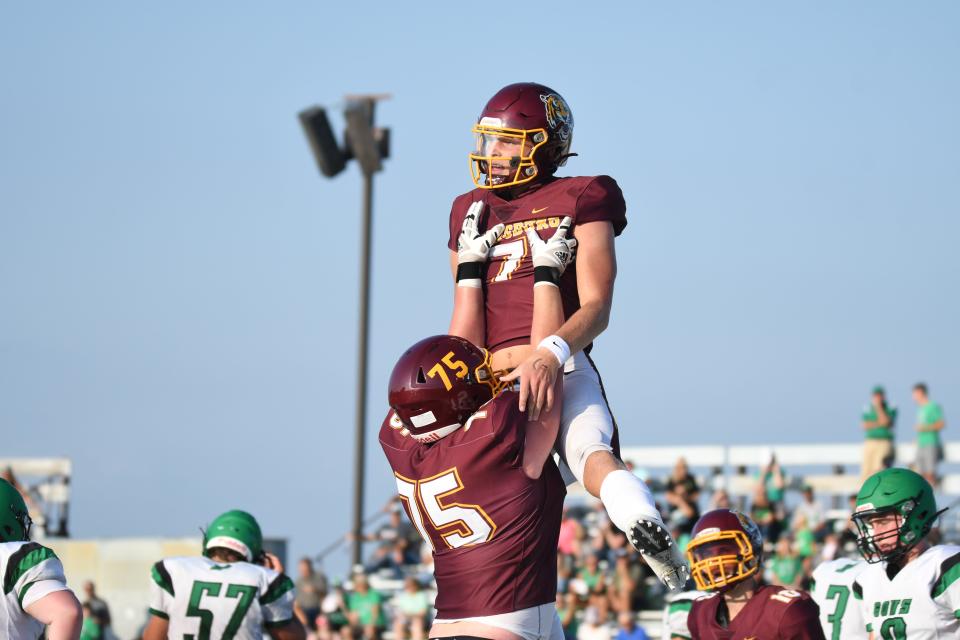 Harrisburg Tigers Jacob Knuth (7) gets a lift from Mason Jacobson (75) to celebrate Knuth's TD against Pierre on Friday night.