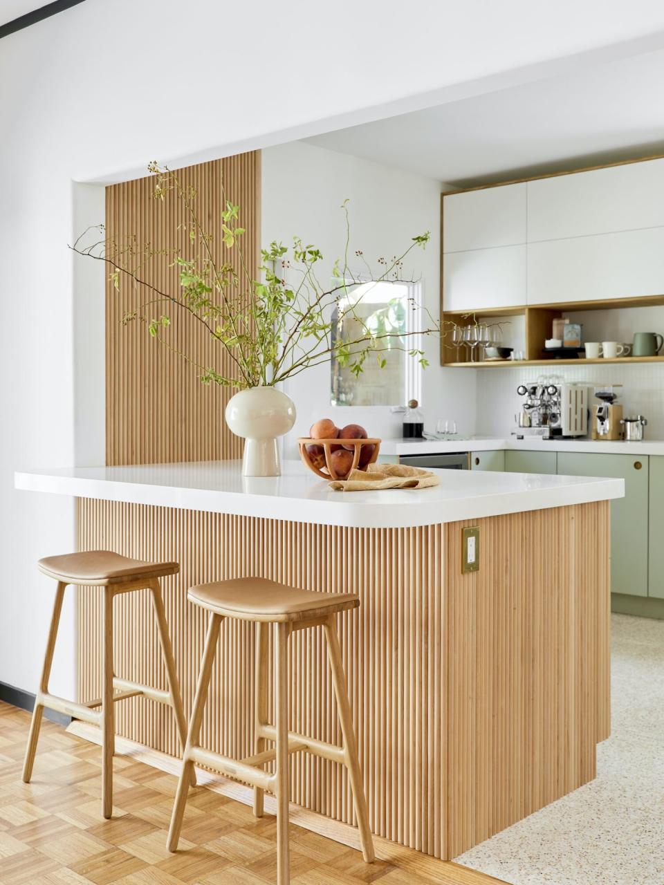 kitchen with tabour island, green cabinets, wooden stools