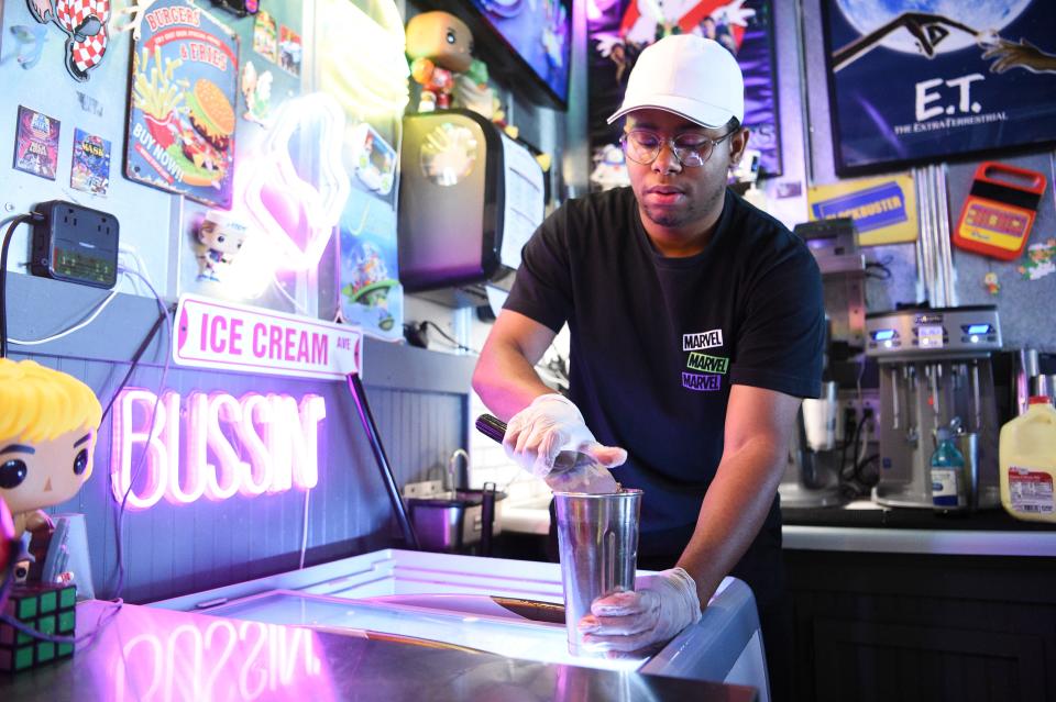 Robert Smith scoops ice cream to make a milkshake at Bit Burger in Cedar Bluff, Saturday, July 1, 2023.