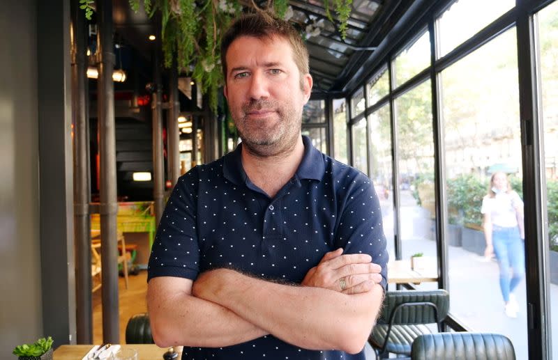 Christophe Naudin, Bataclan attack survivor, poses during an interview with Reuters in Paris