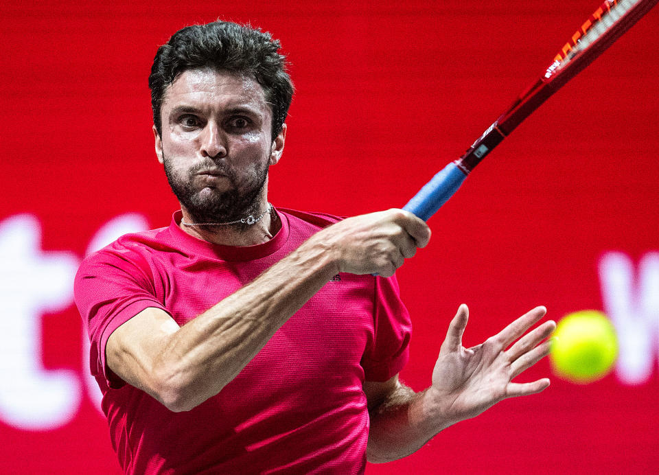 Gilles Simon hitting a forehand.