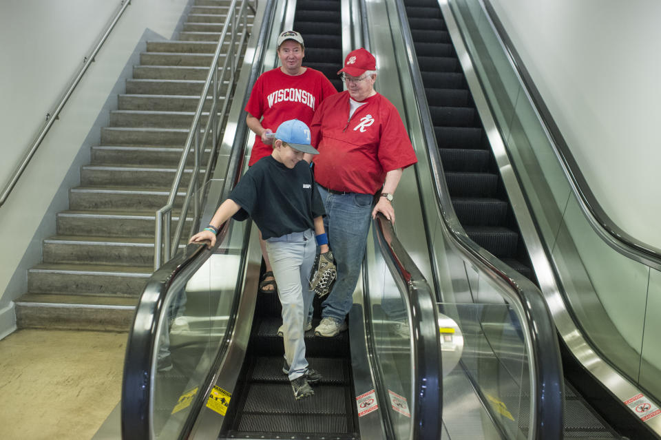 Rep. Joe Barton (R-Texas), right, and his sons, Jack, 10, and Brad, arrive in the basement of the Capitol after a shooting at the Republican baseball practice in Alexandria, Virginia, on June 14, 2017.