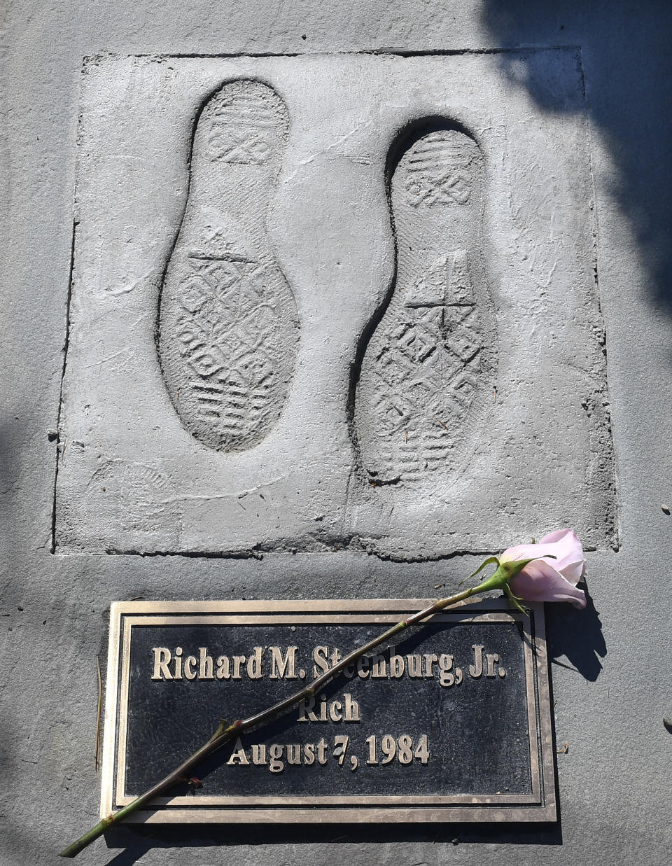 View of remembrance stone in memory of Richard M. Steenburg, Jr. at the Reflections Memorial unveiling ceremony, on the one year anniversary of the Schoharie limousine crash that killed 20 people, Saturday, Oct. 5, 2019, in Schoharie, N.Y. The memorial featuring 20 stones in a semicircle is to be viewed privately by family members and first responders Saturday morning. The public is welcome Sunday. (AP Photo/Hans Pennink)