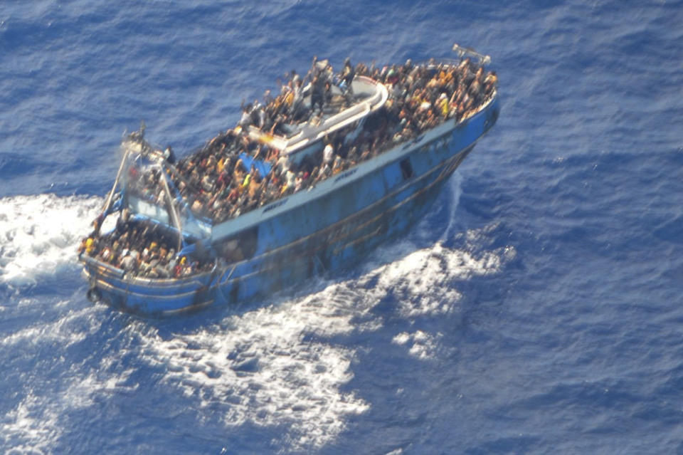 This undated handout image provided by Greece's coast guard on Wednesday, June14, 2023, shows scores of people on a battered fishing boat that later capsized and sank off southern Greece. A fishing boat carrying migrants trying to reach Europe capsized and sank off Greece on Wednesday, authorities said, leaving at least 79 dead and many more missing in one of the worst disasters of its kind this year.(Hellenic Coast Guard via AP)