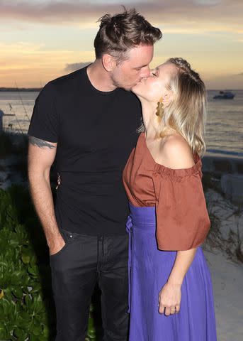 <p>John Parra/Getty</p> Dax Shepard and Kristen Bell pose at Beaches Turks & Caicos Resort on Jan. 30, 2018.