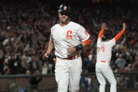 San Francisco Giants' Buster Posey runs home to score against the Los Angeles Dodgers during the eighth inning of a baseball game in San Francisco, Tuesday, July 27, 2021. (AP Photo/Jeff Chiu)