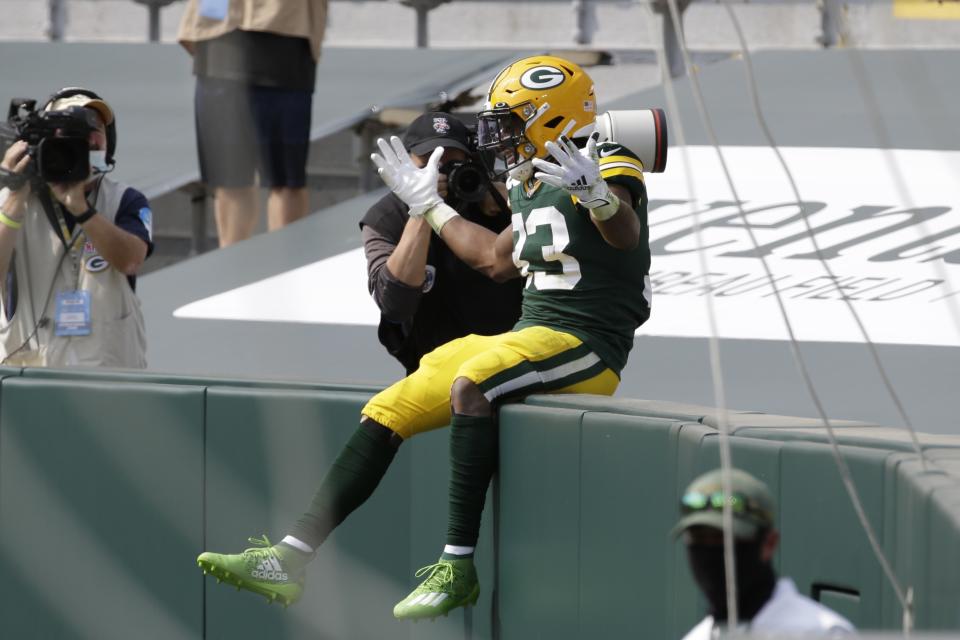 Green Bay Packers' Aaron Jones celebrates his touchdown catch during the first half of an NFL football game against the Detroit Lions Sunday, Sept. 20, 2020, in Green Bay, Wis. (AP Photo/Mike Roemer)