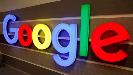 FILE PHOTO: An illuminated Google logo is seen inside an office building in Zurich, Switzerland December 5, 2018. REUTERS/Arnd Wiegmann/File Photo