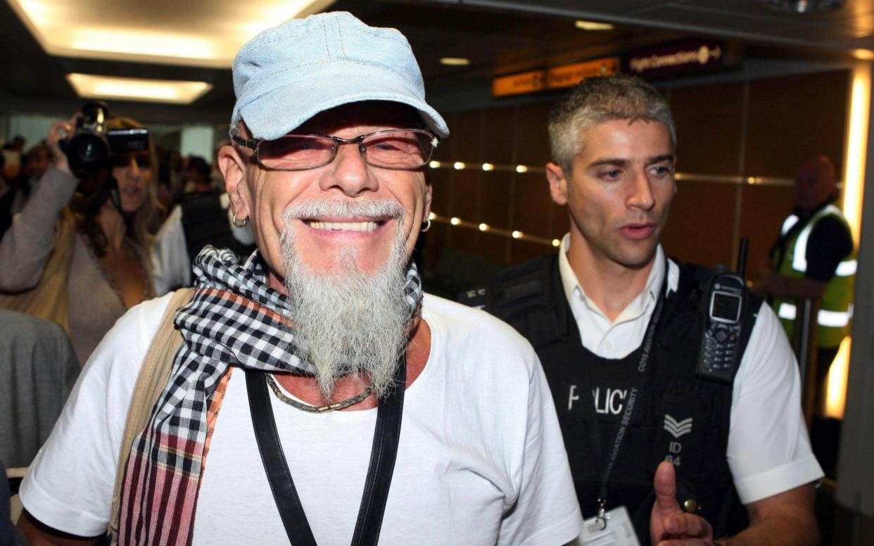 Paedophile pop star Gary Glitter arrives at Heathrow Airport - PA