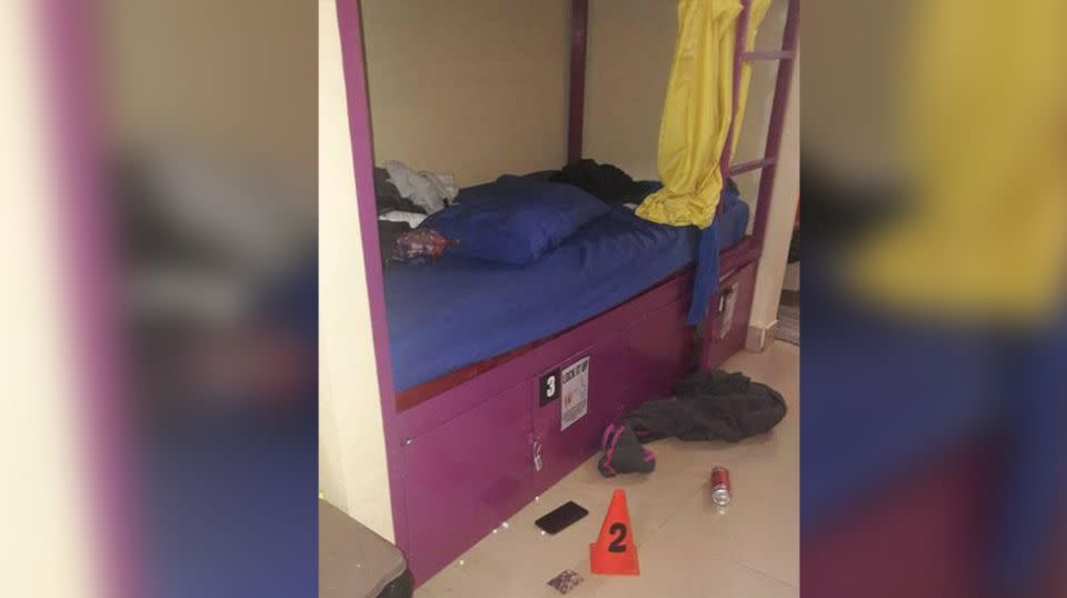 The bunk beds where the backpackers were found dead, with pills scattered on the ground. Source: Department of Immigration