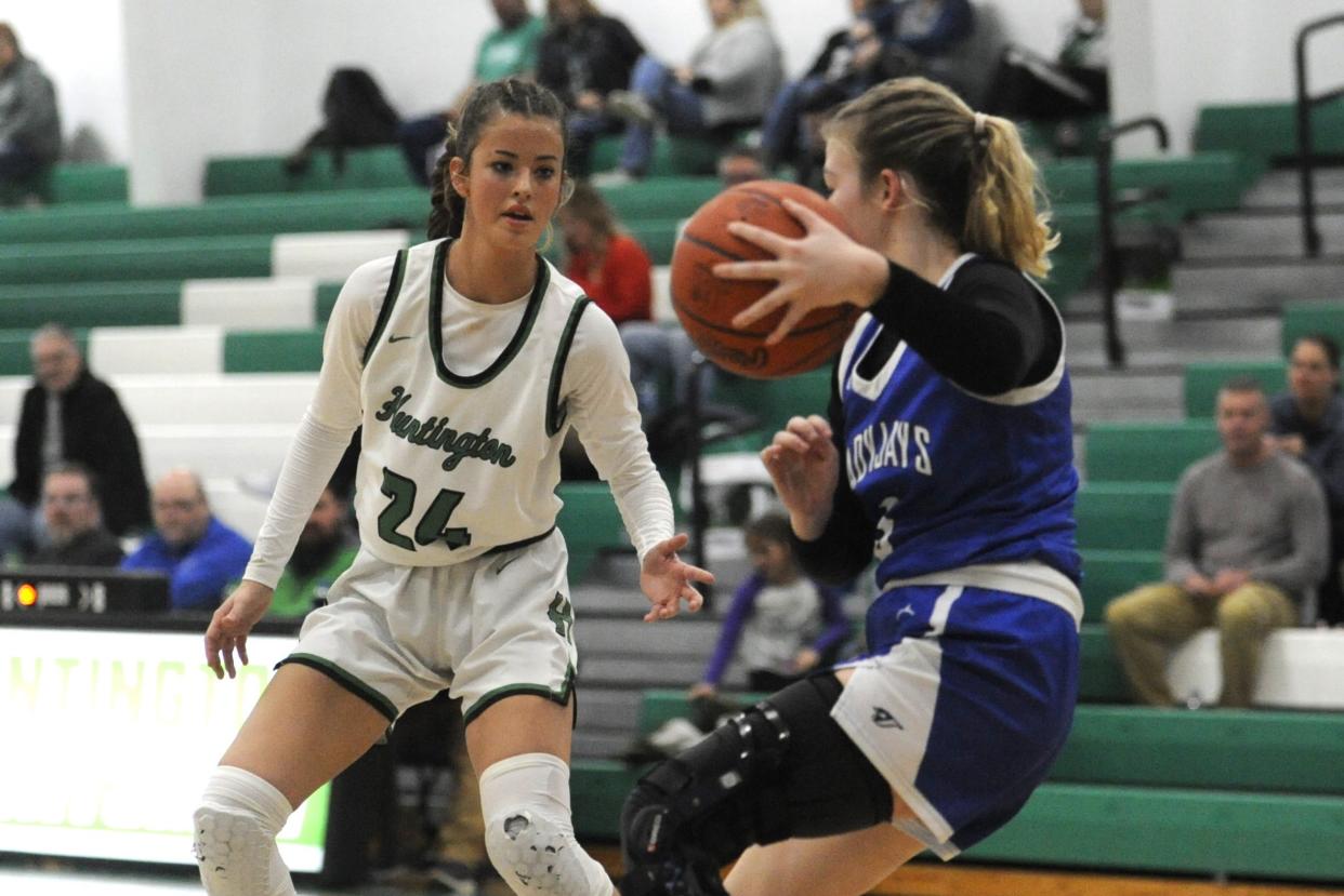 Huntington's Emma Hinshaw (#24) defends as a Ripley player attempts to drive down the court during the Huntsmen's game against the Ladyjays at Huntington High School on Dec. 14, 2023, in Huntington Township, Ohio. Huntington won the game 58-38.