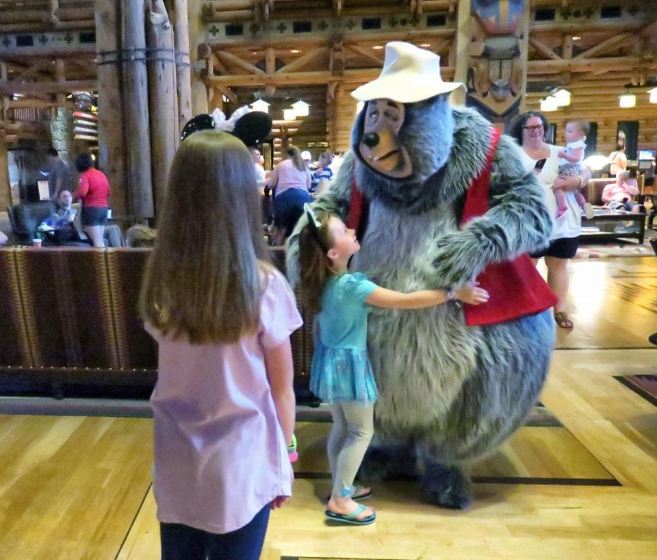 Disney character Big Al entertains children during Hurricane Ian shut in (Orlando Sentinel)
