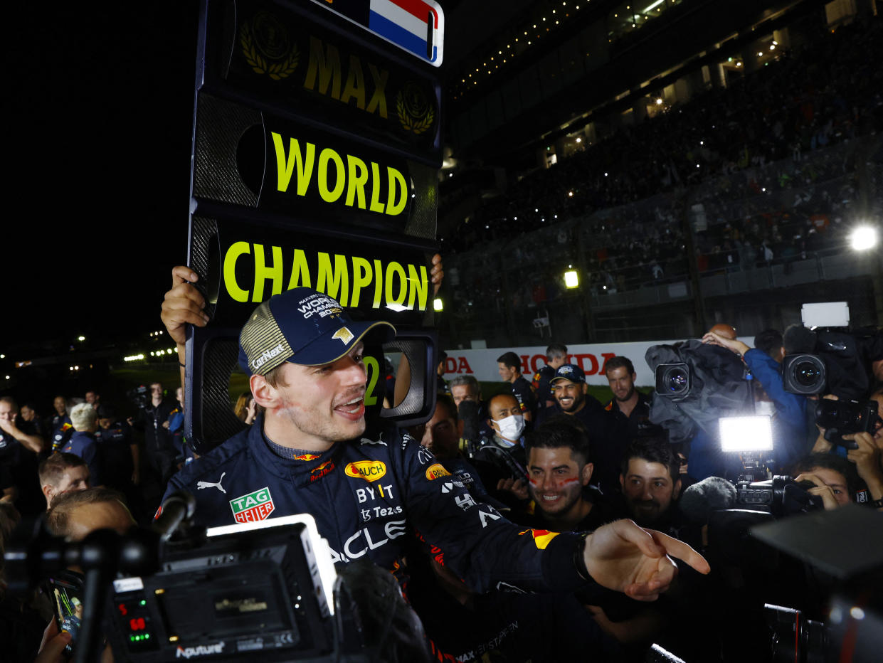 Formula One F1 - Japanese Grand Prix - Suzuka Circuit, Suzuka, Japan - October 9, 2022 Red Bull's Max Verstappen celebrates winning the race and the championship with his team REUTERS/Kim Kyung-Hoon