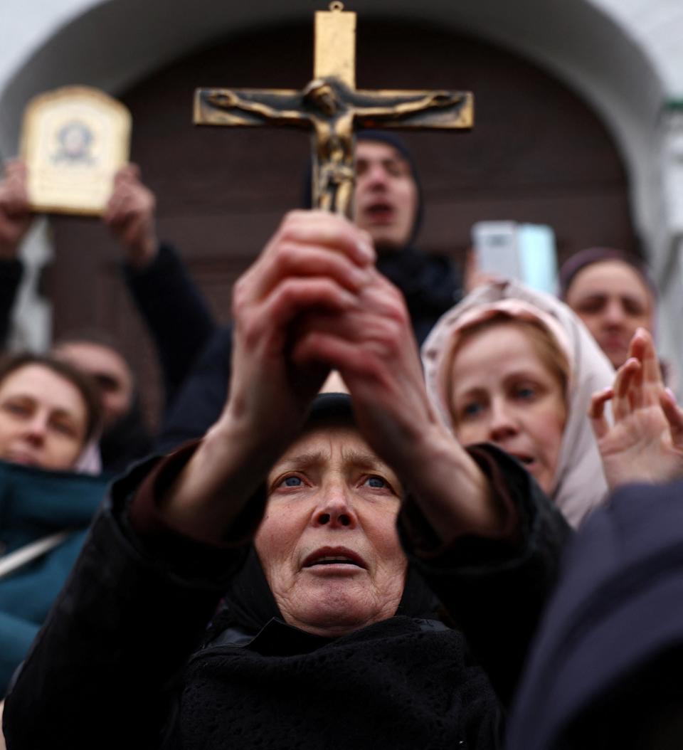 Believers of the Ukrainian Orthodox Church accused of being linked to Moscow, block an entrance to a church at a compound of the Kyiv Pechersk Lavra monastery (REUTERS)