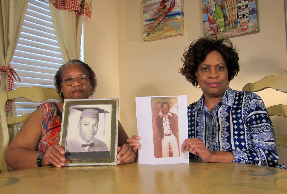 James Byrd Jr's sisters Mylinda Byrd Washington (left) and Louvon Byrd Harris (61) with photographs of their brother (AP Photo/Juan Lozano)