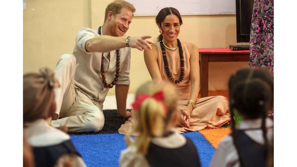 Prince Harry and Meghan Markle in a classroom