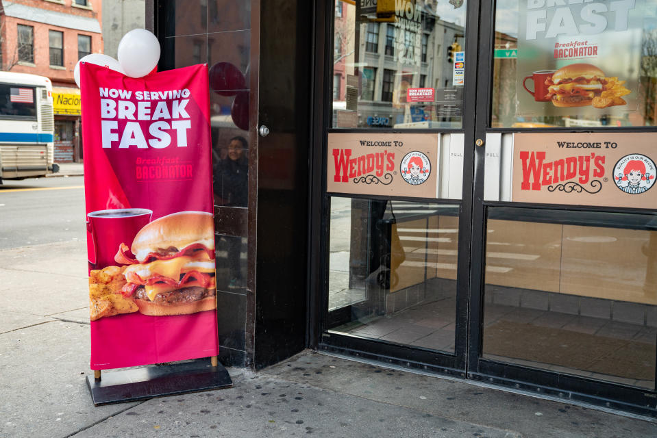 NEW YORK, NY - MARCH 2: A banner announcing Now Serving Breakfast is shown outside a Wendy's restaurant on March 2, 2020 in New York City. Wendy's introduced its breakfast menu nationwide today, featuring items such as the Breakfast Baconator, the Honey Butter Chicken Biscuit and the Frosty-ccino.  (Photo by David Dee Delgado/Getty Images)