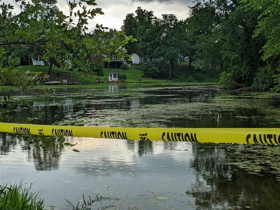 An area of the Huron River is cordoned off from human contact at Milford's Central Park on August 3, 2022, following a release of potentially cancer-causing hexavalent chromium from Wixom auto supplier Tribar Manufacturing.
