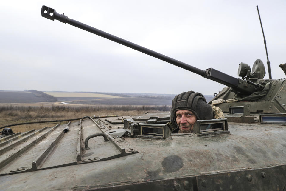 A Ukrainian soldier looks out of an APC during combat training in Zaporizhzhia region, Ukraine, Tuesday, Jan. 24, 2023. (AP Photo/Kateryna Klochko)