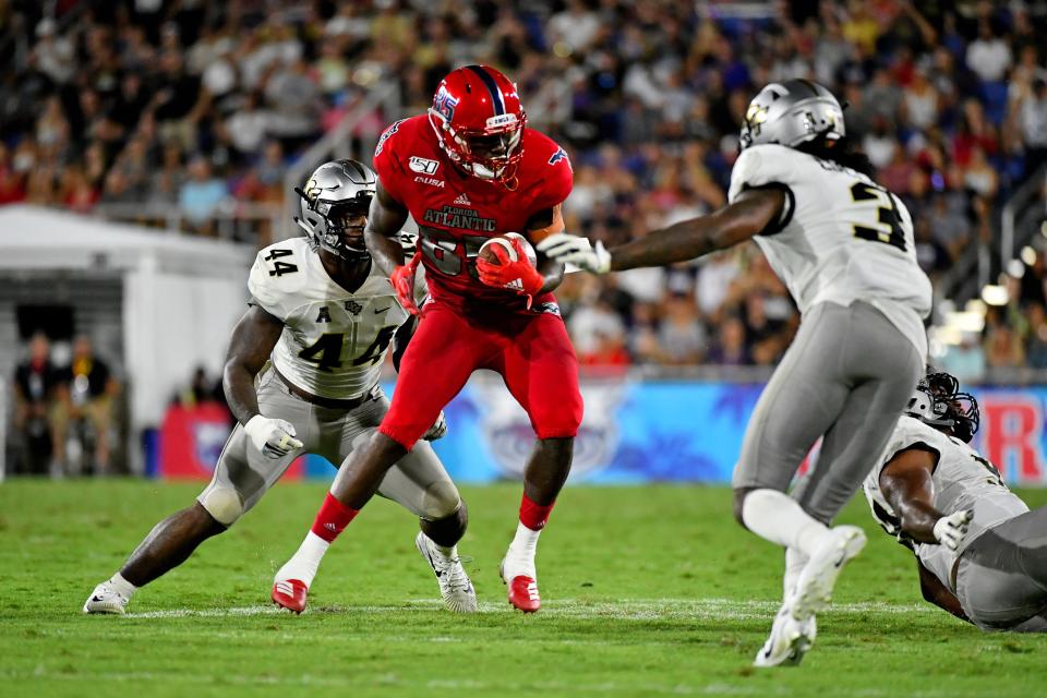 Sep 7, 2019; Boca Raton, FL, USA; Florida Atlantic Owls wide receiver John Mitchell (85) makes a catch before running with the ball against the UCF Knights during the first half at FAU Football Stadium. Mandatory Credit: Jasen Vinlove-USA TODAY Sports