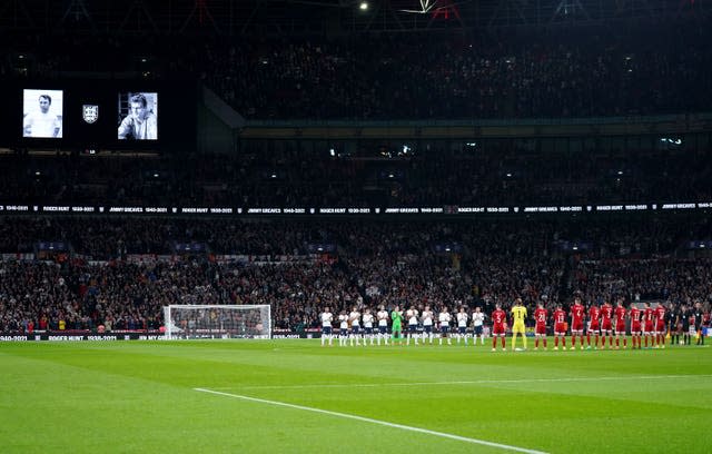 Players and fans take part in a minute’s applause in memory of Jimmy Greaves and Roger Hunt