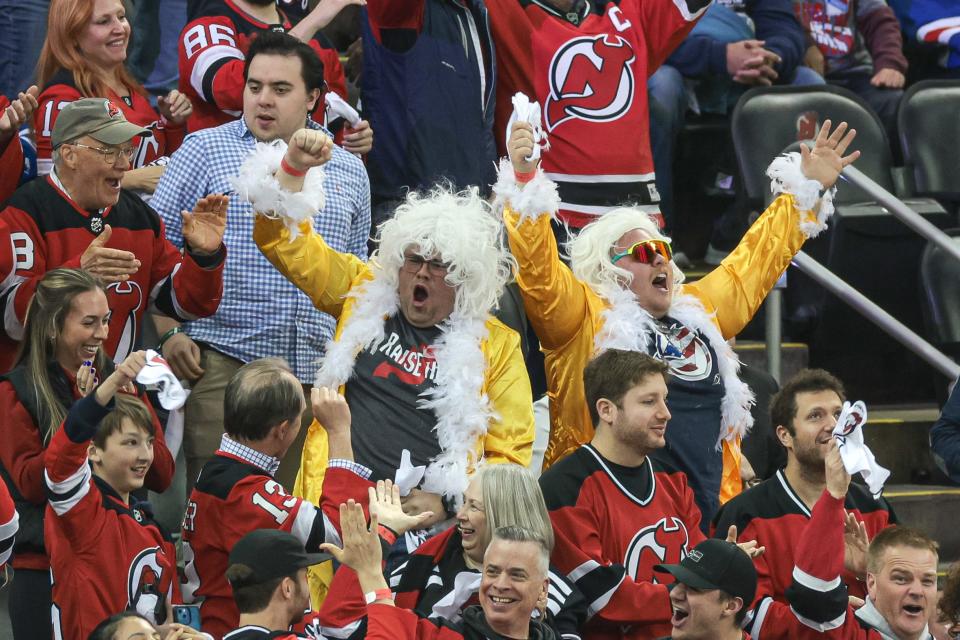 Apr 20, 2023; Newark, New Jersey, USA; New Jersey Devils fans celebrate after a goal by left wing Erik Haula (not pictured) during the first period in game two of the first round of the 2023 Stanley Cup Playoffs against the New York Rangers at Prudential Center. Mandatory Credit: Vincent Carchietta-USA TODAY Sports