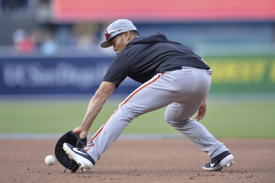 San Francisco Giants' Connor Joe fields a ground ball during batting practice in 2019.