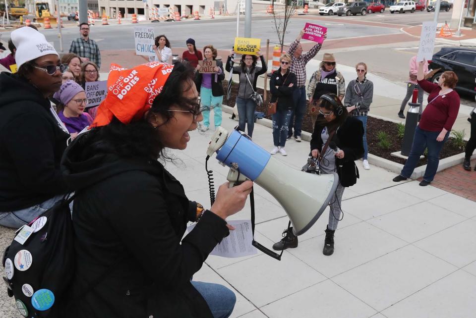 Parinita Singh, organizer of the "Bans Off Our Bodies Rally -- Abortion Rights are Human Rights" rally, speaks to the crowd gathered Tuesday in downtown Akron to protest the leaked Supreme Court decision that would reverse Roe V. Wade.