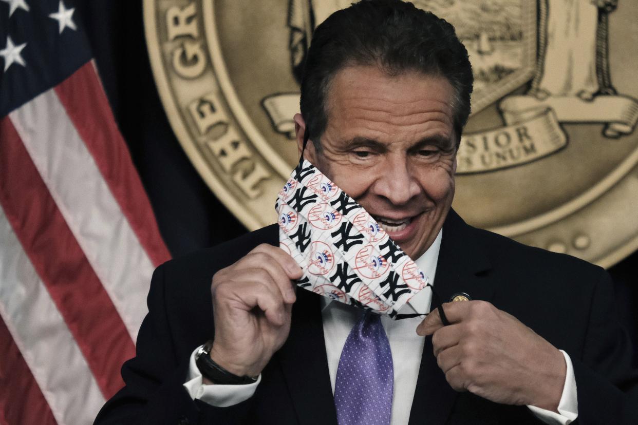 New York Gov. Andrew Cuomo removes his mask during a news conference, Wednesday, May 5, in New York. Gov. Cuomo said Broadway theaters can reopen Sept. 14 and will be allowed to decide their own entry requirements, like whether people must prove they've been vaccinated to attend a show. 