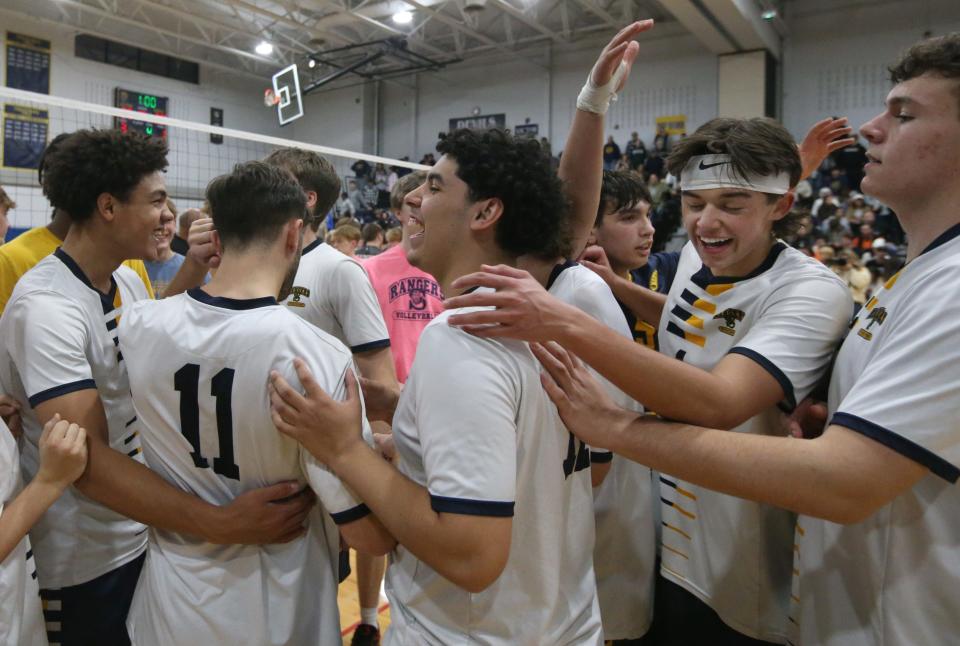 Spencerport celebrates after the final point over Churchville-Chili giving them a 3-1 victory.