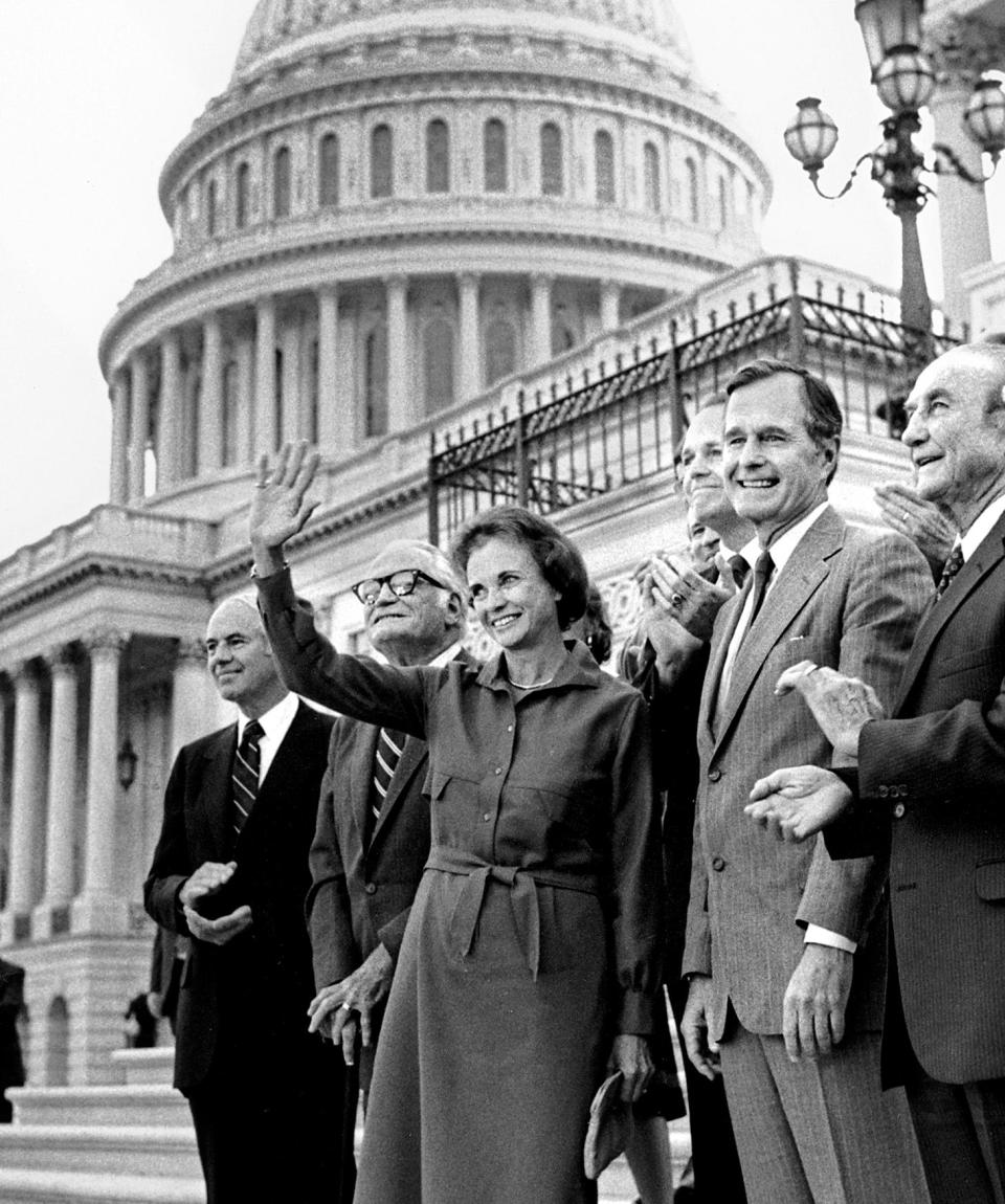 Sandra Day O'Connor waves after her unanimous confirmation by the U.S. Senate to the Supreme Court in this Sept. 21, 1981 photo.