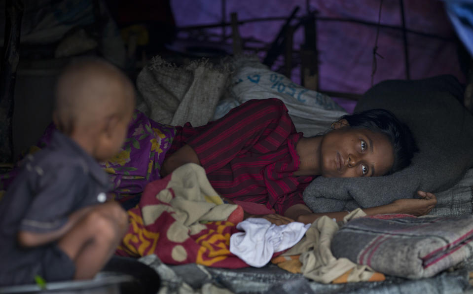 In this Sept. 17, 2013 photo, a sick Muslim woman, who become displaced following 2012 sectarian violence, rests in a camp for displaced at Nga Chaung Refugee Camp in Pauktaw, Rakhine state, Myanmar. Severe shortages of food, water and medical care for Rohingya Muslims in western Myanmar are part of a long history of persecution against the religious minority that could amount to "crimes against humanity," according to a statement released Monday April 7, 2014, from Tomas Ojea Quintana, the U.N. Special Rapporteur on the human rights situation in the country. (AP Photo/Gemunu Amarasinghe)