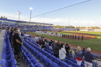 The Los Angeles Angels and Toronto Blue Jays line up for the anthems prior to a baseball game Thursday, April 8, 2021, in Dunedin, Fla. (AP Photo/Mike Carlson)