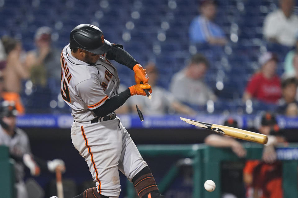 San Francisco Giants' Thairo Estrada breaks his bat on a ground out during the 11th inning of a baseball game against the Philadelphia Phillies, Tuesday, May 31, 2022, in Philadelphia. (AP Photo/Matt Slocum)